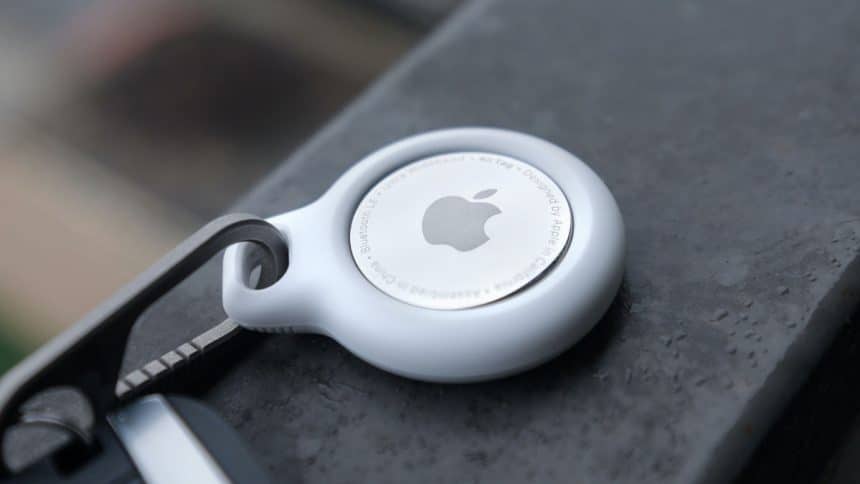 Apple AirTag attached to a keychain.