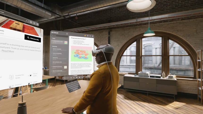 Man using Apple Vision Pro headset in a modern workspace.