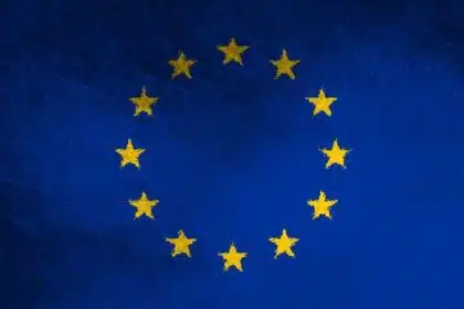 European Union flag with yellow stars on a blue background.