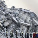 Rescue workers search through collapsed buildings after the Myanmar-Thailand earthquake.