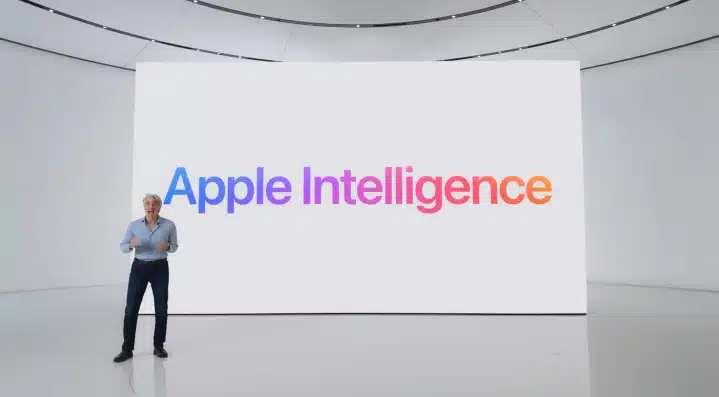 Apple executive presenting Apple Intelligence on stage.