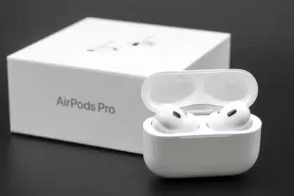 AirPods Pro earbuds with charging case and box.