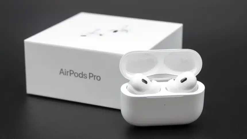 AirPods Pro earbuds with charging case and box.