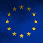 European Union flag with yellow stars on a blue background.