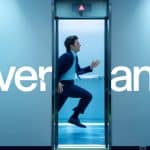 Severance TV show scene with a man running through elevator doors.