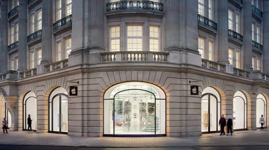 Front view of the Apple Store in Amsterdam with glass entrance and classical architecture.