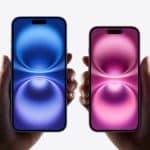 Two hands holding blue and pink iPhones.