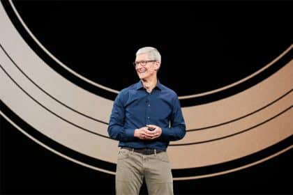 Tim Cook speaking on stage at an Apple event.