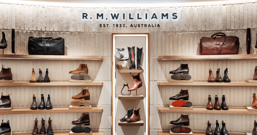 R.M. Williams store display with boots, bags, and accessories.