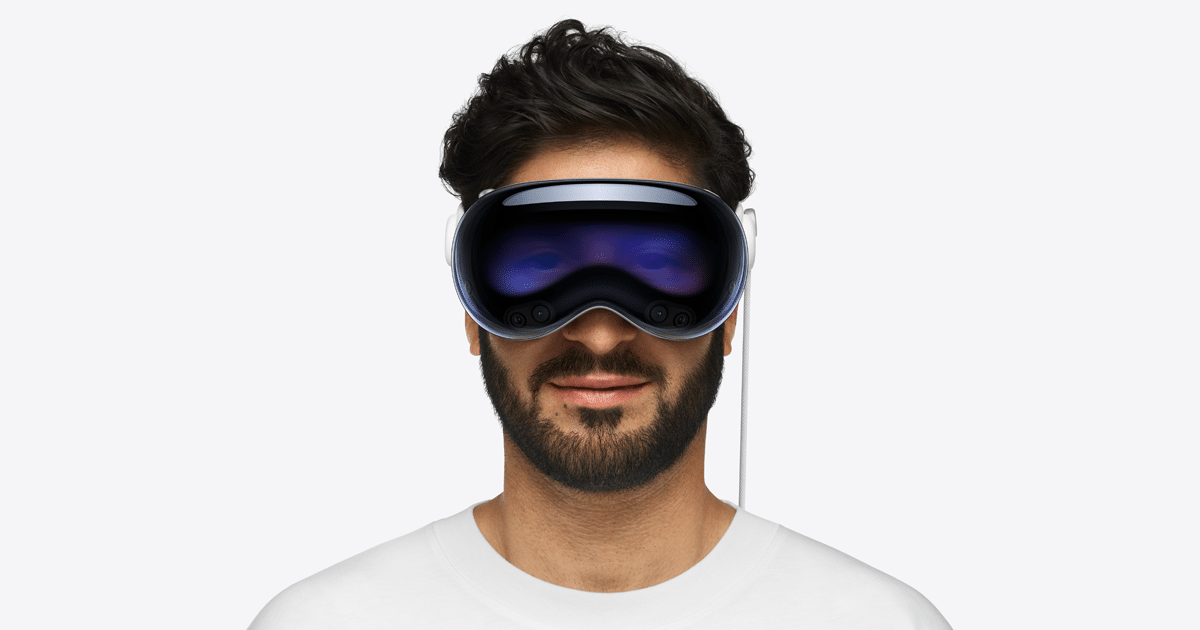 Man wearing Apple Vision Pro headset.