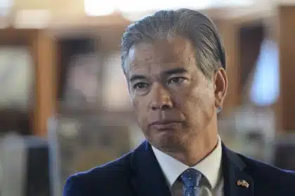 California Attorney General Rob Bonta looks serious during a press event.