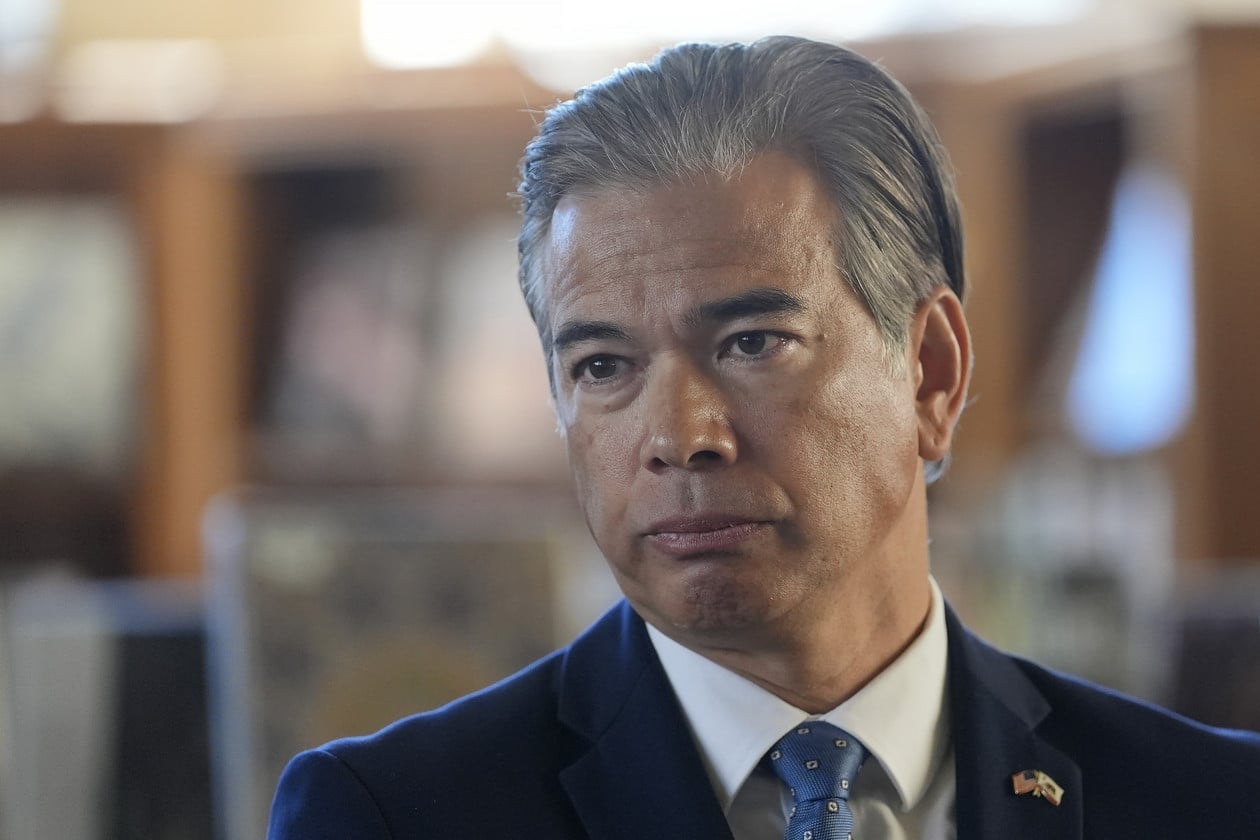 California Attorney General Rob Bonta looks serious during a press event.