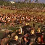 Roman and Greek soldiers clash with spears in a battle scene from Total War: Rome II.