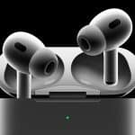 AirPods Pro 3 earbuds hovering above their open charging case against a black background.