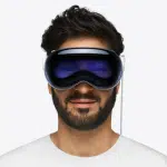 Man wearing Apple Vision Pro headset with front-facing display.