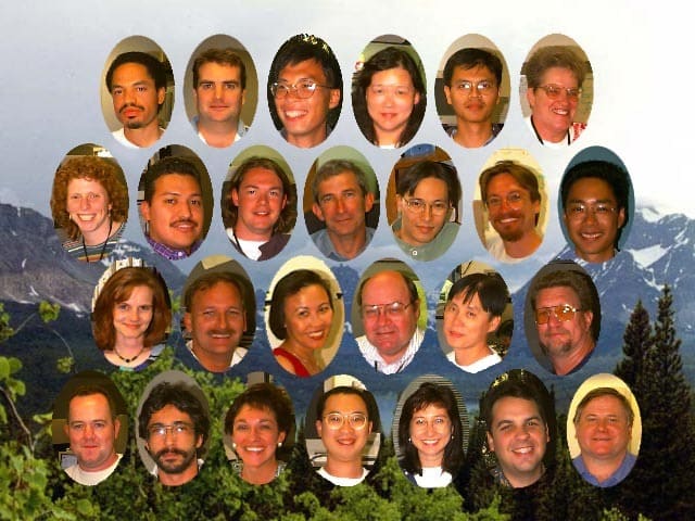 Group photo of the Power Mac G3 engineering team with a mountain background.