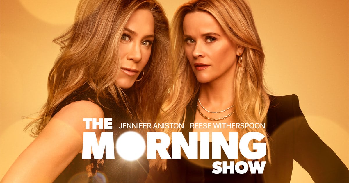 Jennifer Aniston and Reese Witherspoon pose in a poster for “The Morning Show.”