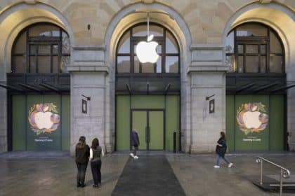 People stand outside the new Apple Store in Perth City, set in a historic building.