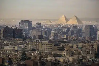 Cairo skyline with the Giza pyramids in the background.