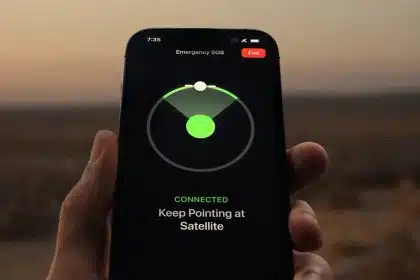 Hand holding an iPhone displaying the Emergency SOS satellite connection screen.