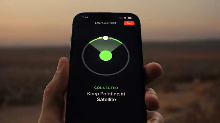 Hand holding an iPhone displaying the Emergency SOS satellite connection screen.
