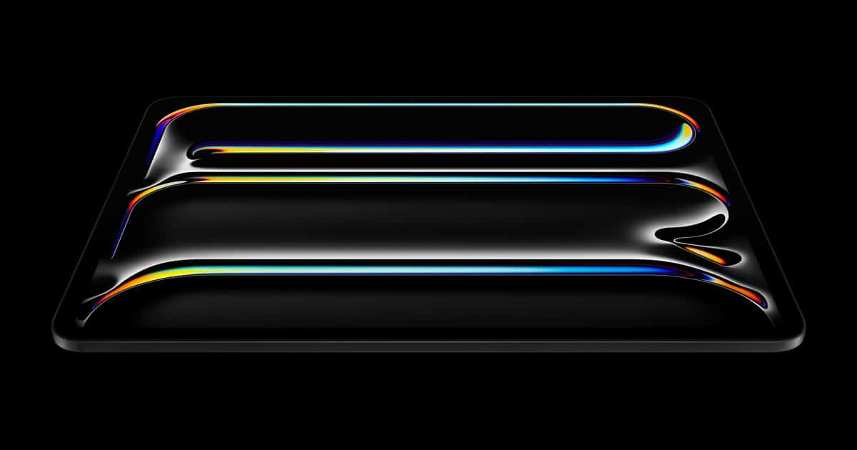 Artistic render of an iPad Pro with colorful light reflections on its surface.