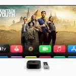 Apple TV home screen showing ‘Fountain of Youth’ banner above app icons, with Apple TV 4K box and Siri Remote below.