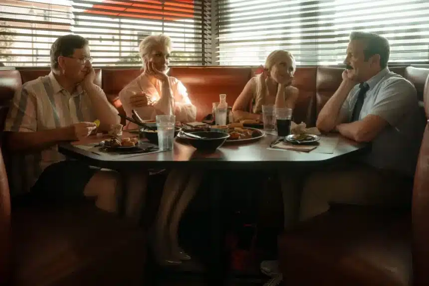 Ted Lasso cast sitting in a diner booth having a conversation.