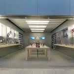 Apple Store with product displays and tables inside a shopping mall.