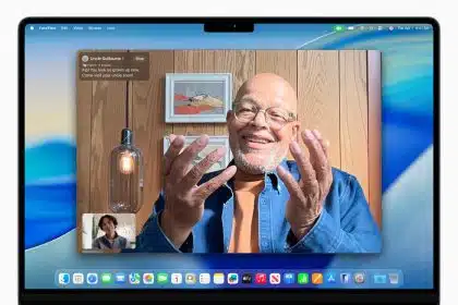 Person using FaceTime on a MacBook running macOS Tahoe.