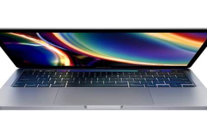 A silver MacBook Pro with a colourful screen, partially open.