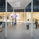 People walking outside the new Apple Umeda store in Osaka, Japan.