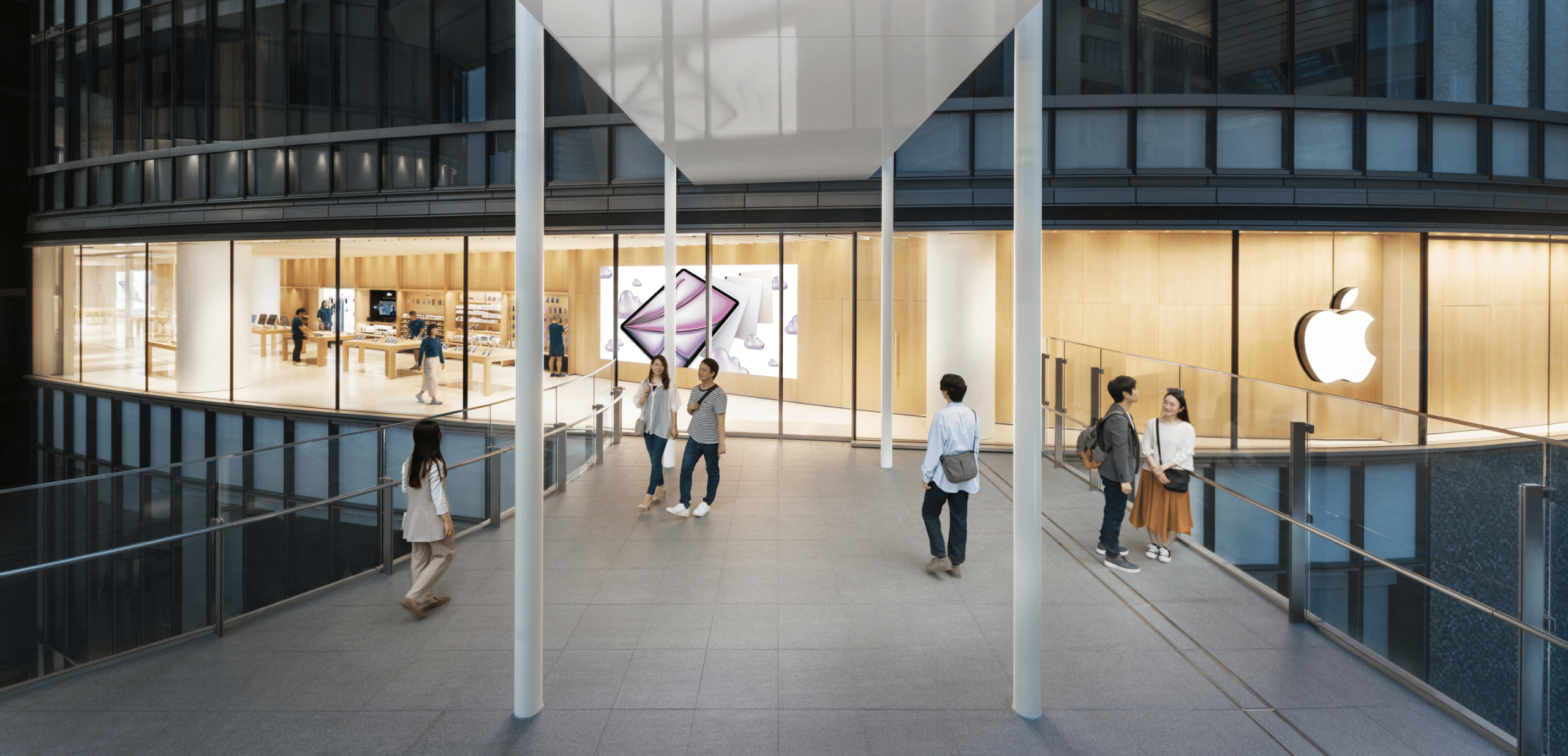 People walking outside the new Apple Umeda store in Osaka, Japan.