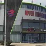 Apple Cinemas building with bold signage and ACX, ScreenX, and IMAX logos visible.
