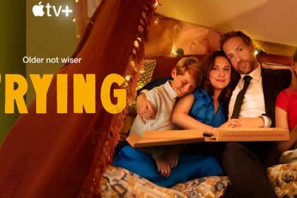 Cast of Apple TV+ series Trying sitting together with pizza in a cozy setting.