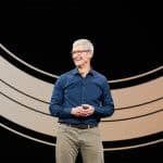 Apple CEO Tim Cook speaking on stage at an event.