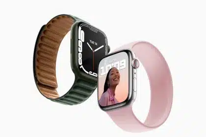 Two Apple Watch models with different bands, one green with leather and one pink with silicone.