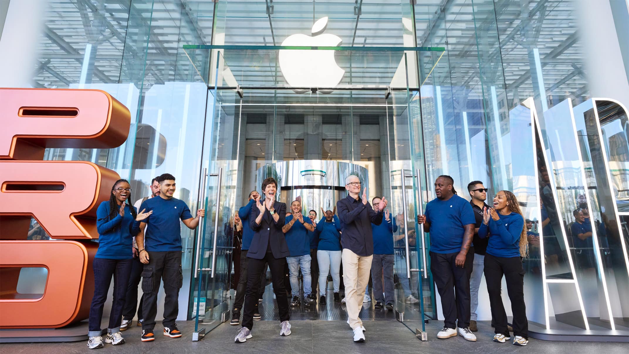 Tim Cook and Apple team greet fans at the iPhone 17 launch in New York.