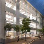 Hong Kong Apple Store with glass facade and street view.