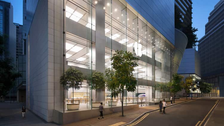 Hong Kong Apple Store with glass facade and street view.