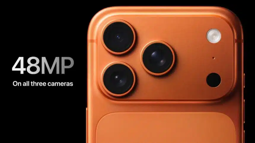 Close-up of the iPhone 17 Pro in orange showing triple 48MP cameras.