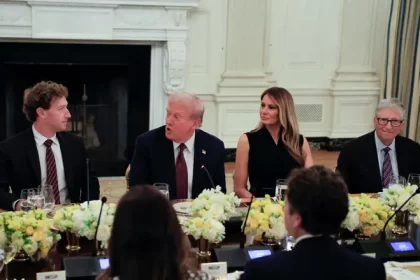 Donald Trump, Melania Trump, and tech leaders sit at a dinner table.