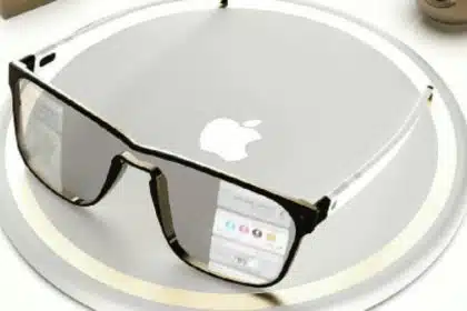 Concept image of Apple Glasses placed on a silver circular surface with the Apple logo.