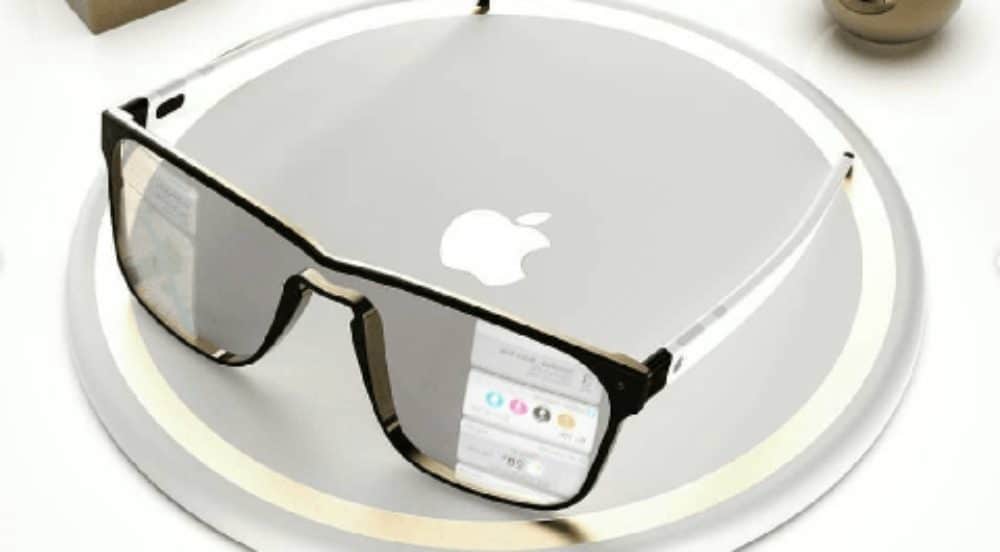 Concept image of Apple Glasses placed on a silver circular surface with the Apple logo.