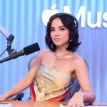 Woman hosting a radio show in an Apple Music studio.