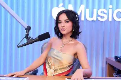 Woman hosting a radio show in an Apple Music studio.