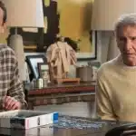 Jason Segel and Harrison Ford sit at a table working on a puzzle in a scene from Shrinking Season 3.