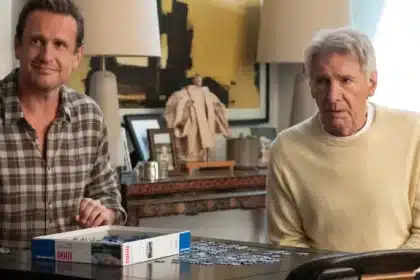 Jason Segel and Harrison Ford sit at a table working on a puzzle in a scene from Shrinking Season 3.