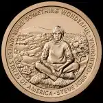 Gold coin featuring Steve Jobs sitting cross-legged with the inscription “Make Something Wonderful.”