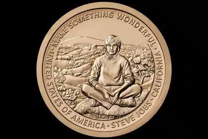 Gold coin featuring Steve Jobs sitting cross-legged with the inscription “Make Something Wonderful.”